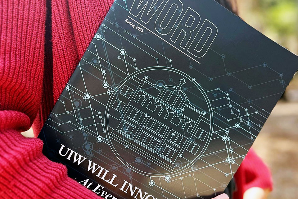 woman holding magazine