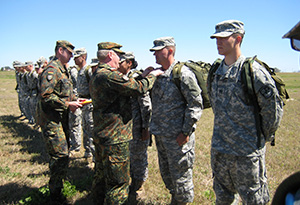 ROTC Students recieving German Proficiency Badge from their officers