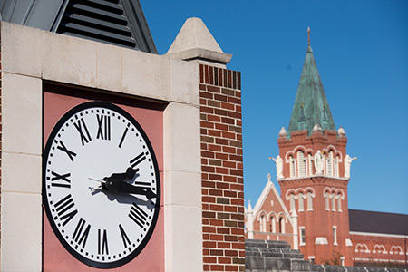 Clock Tower with steeple next to it