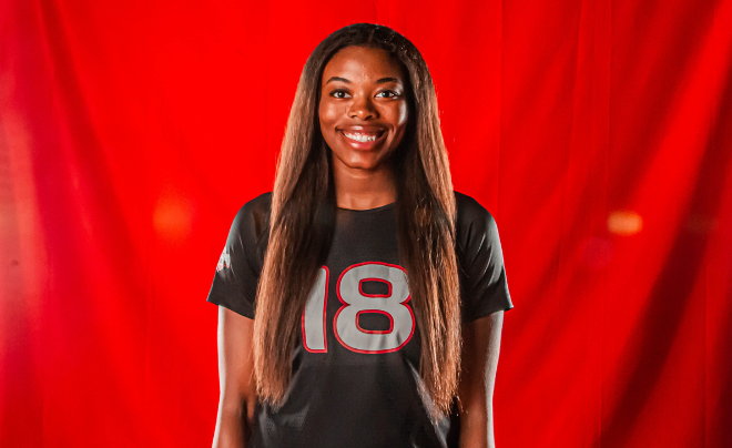 Woman against red background