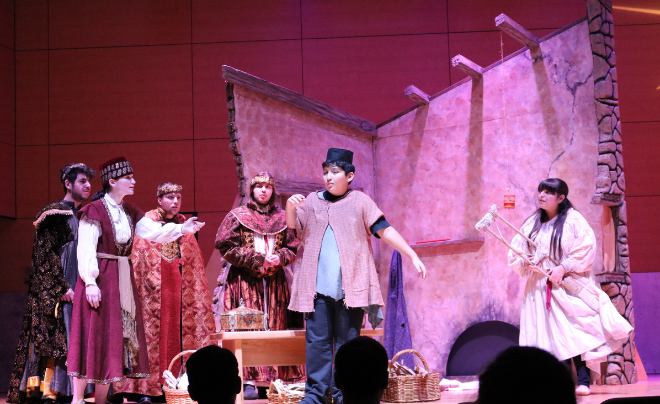 Amahl with the three kings and his mother in the background