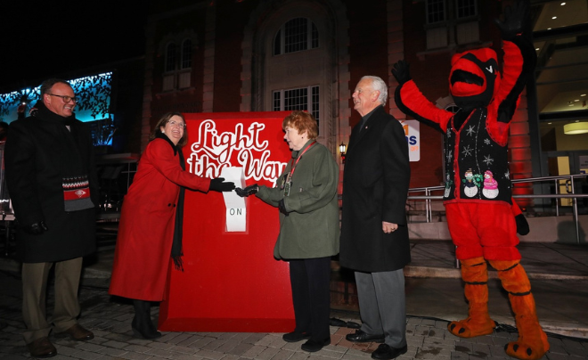 (L-R) – Dr. Thomas M. Evans, Suzanne Goudge, Sr. Kathleen Coughlin, Charlie Lutz and UIW mascot Red the Cardinal flip the switch for Light the Way
