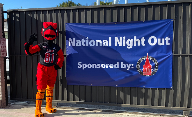 Red in front of the National Night Out banner