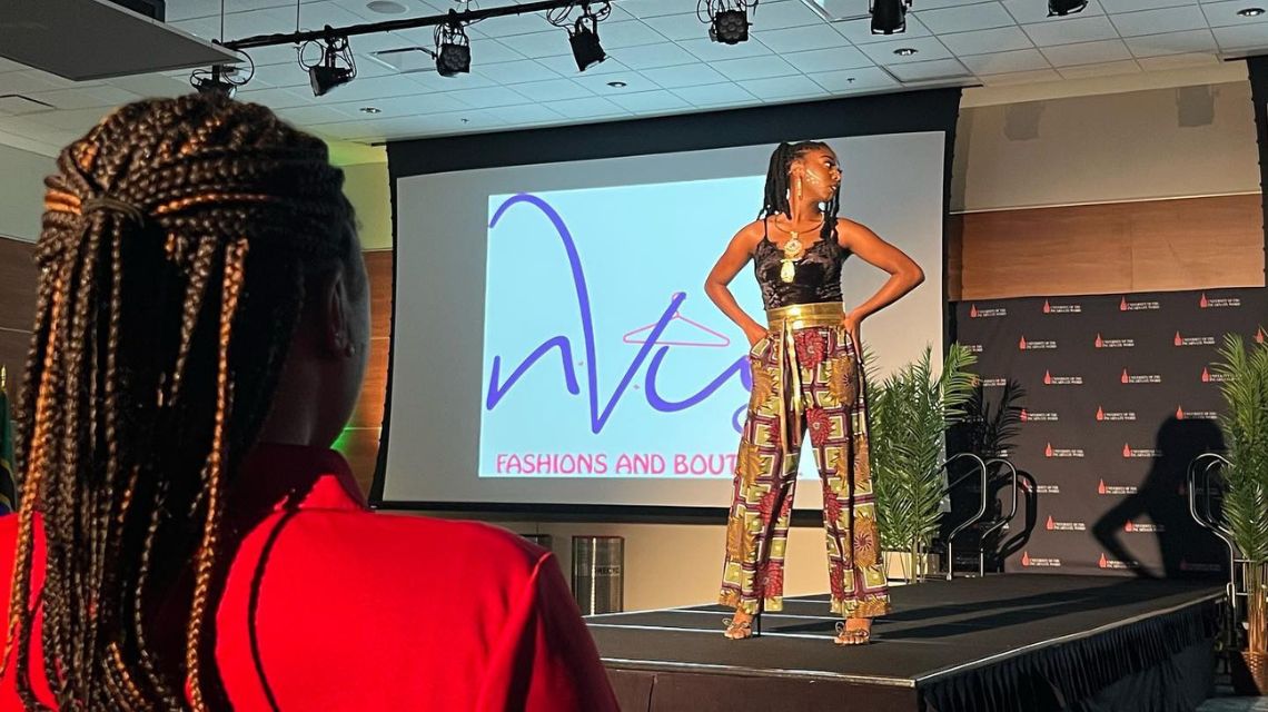 Woman in black top and colorful pants