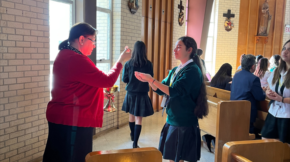 Student receiving the eucharist