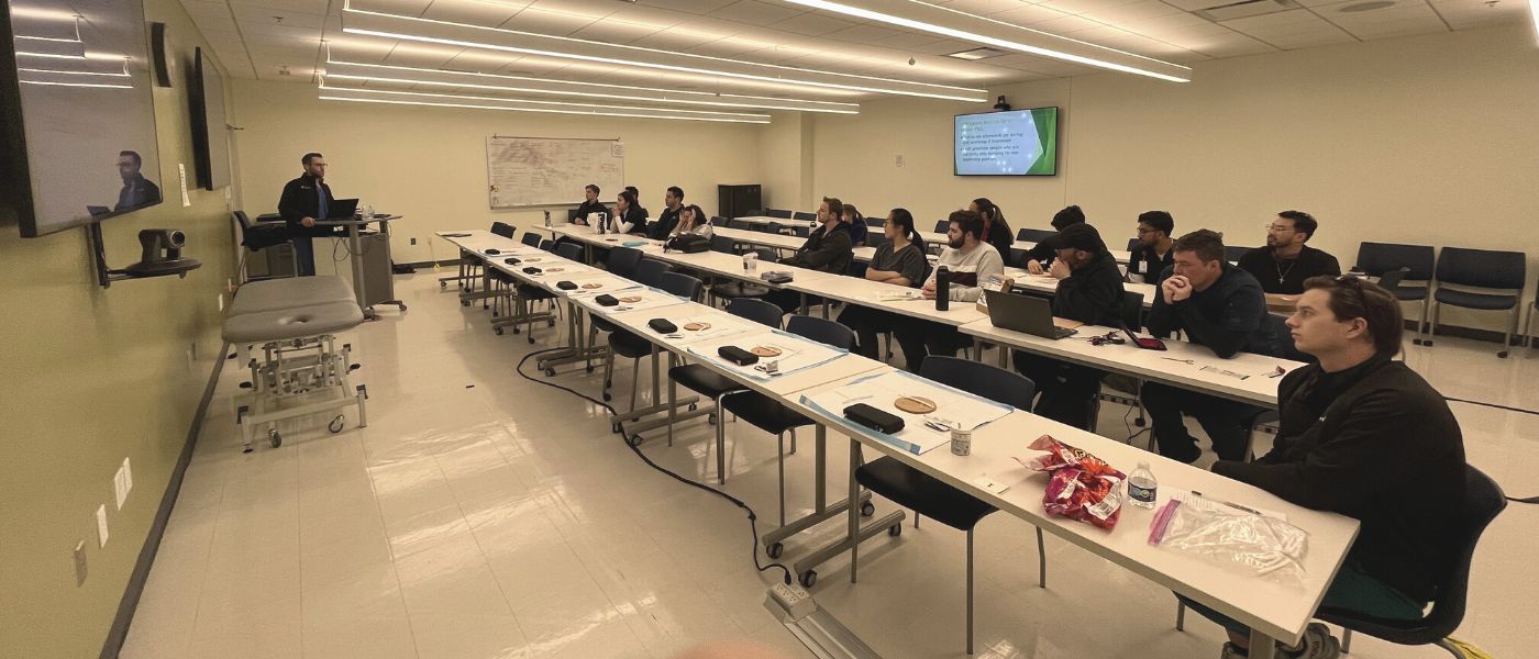 Dr. Kevin Engledow teaching in front of a class of learners