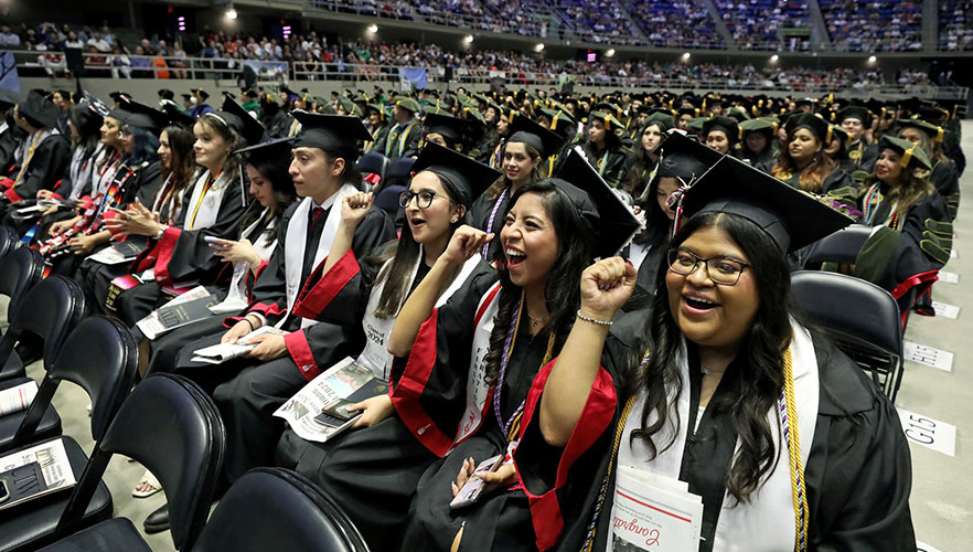 Smiling 2024 graduates