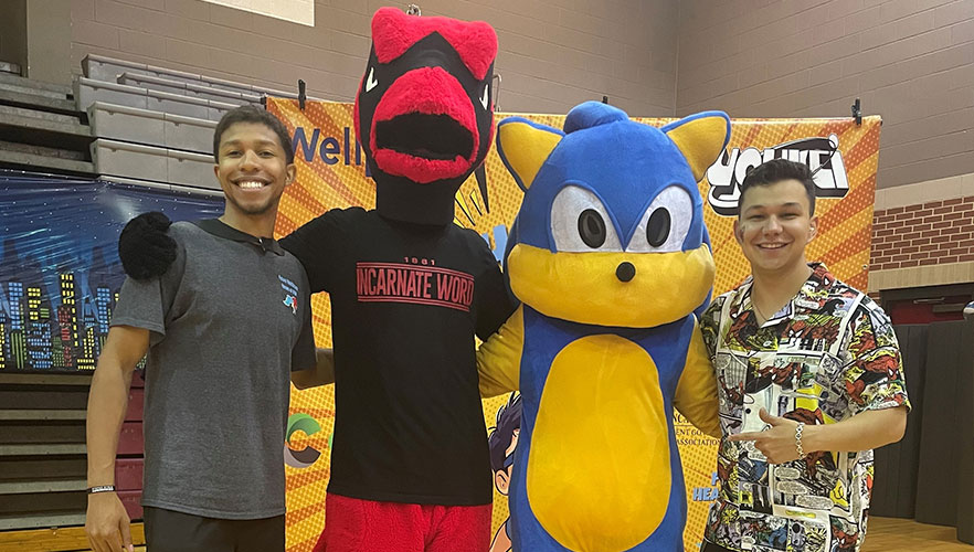 Red the Cardinal with students