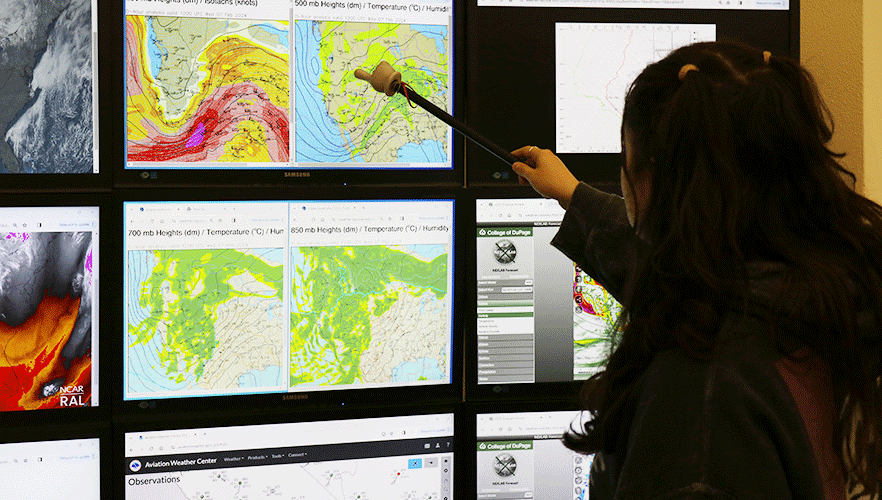 Meteorology student looking at monitor