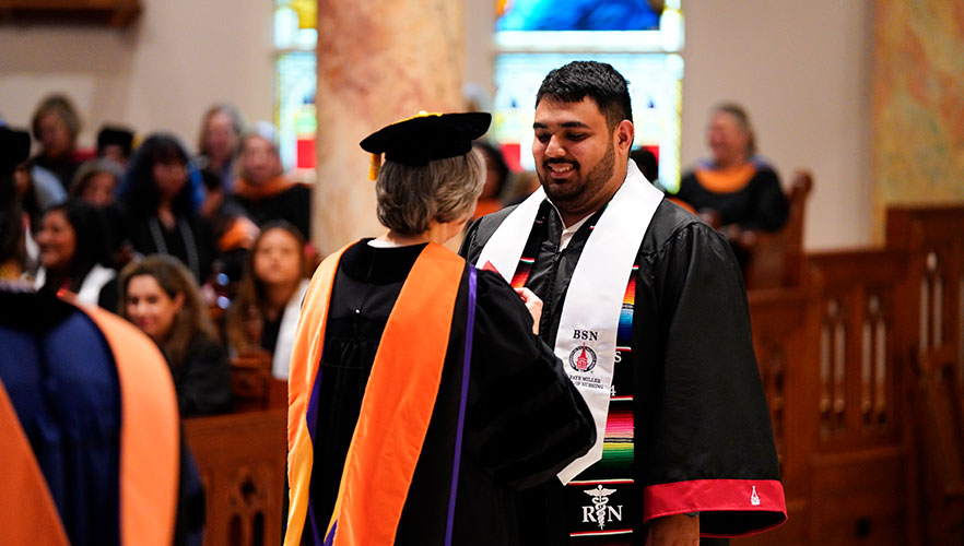 Nursing student at pinning ceremony