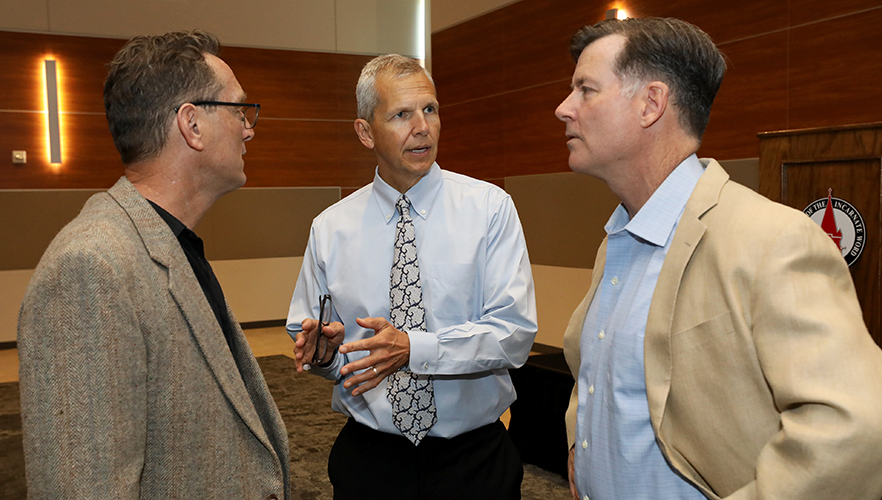 Speakers discussing event