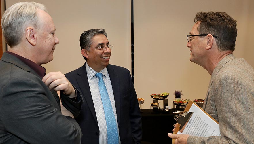 speakers talking after event