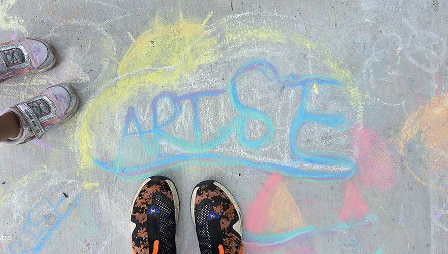 ARISE written in colorful chalk