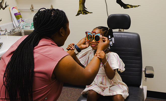Child receiving eye exam
