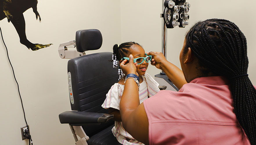 Child receiving eye exam