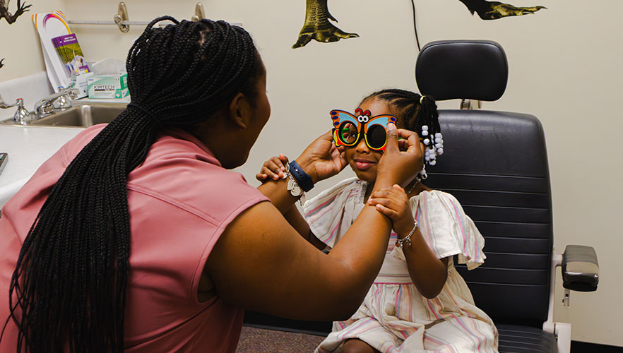 Child receiving eye exam