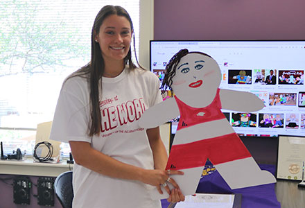 Student with their decorated Cardboard kid