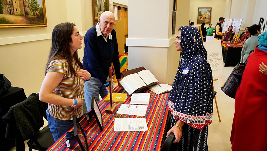 guest listening to presenter at table