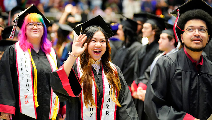 Graduate waving