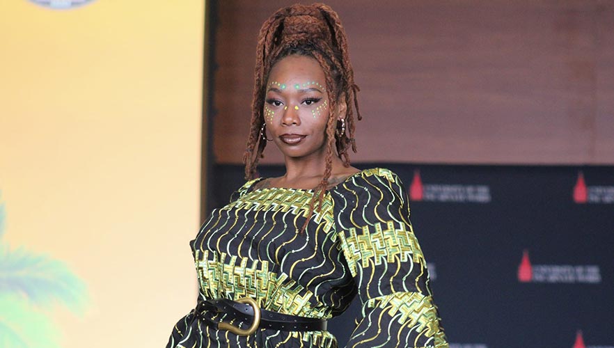 Fashion model wearing green and black dress