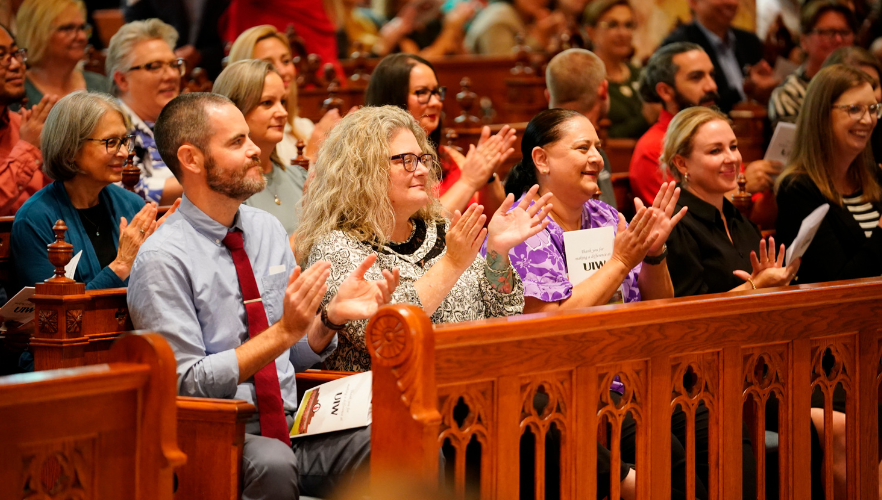 Ceremony attendees clapping
