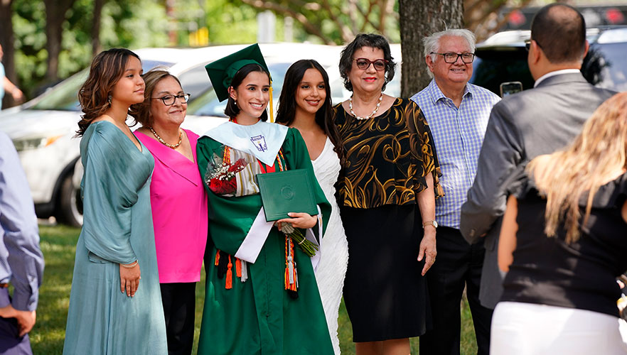 Incarnate Word High School graduate with family