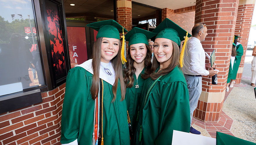 Incarnate Word High School graduates smiling