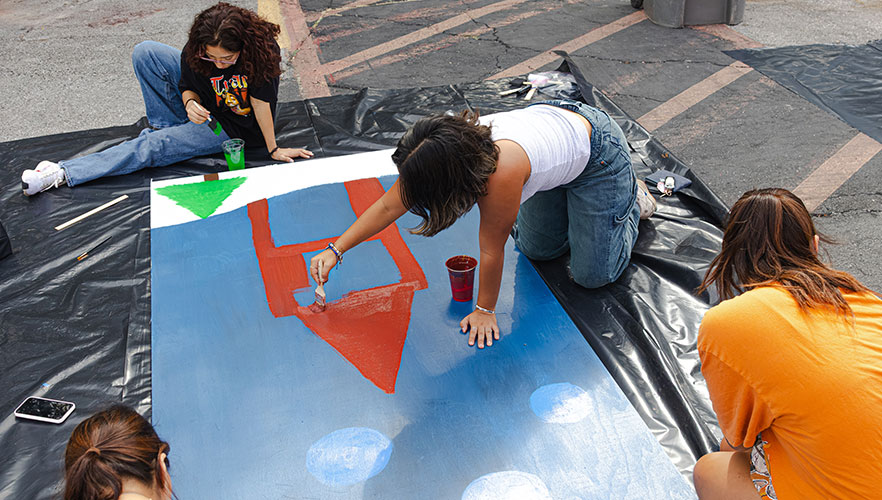 Students painting display board