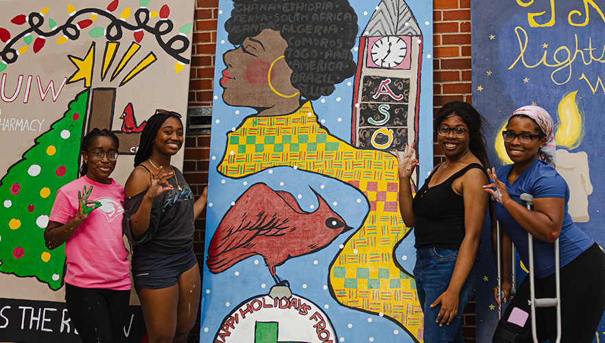 African Student Organization members with display board
