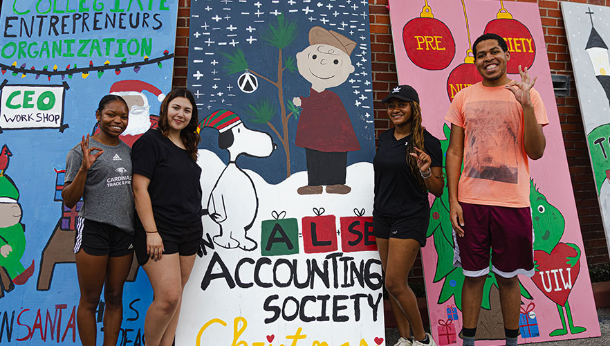 Accounting Society members with display board