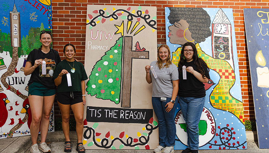 Pharmacy students with display board