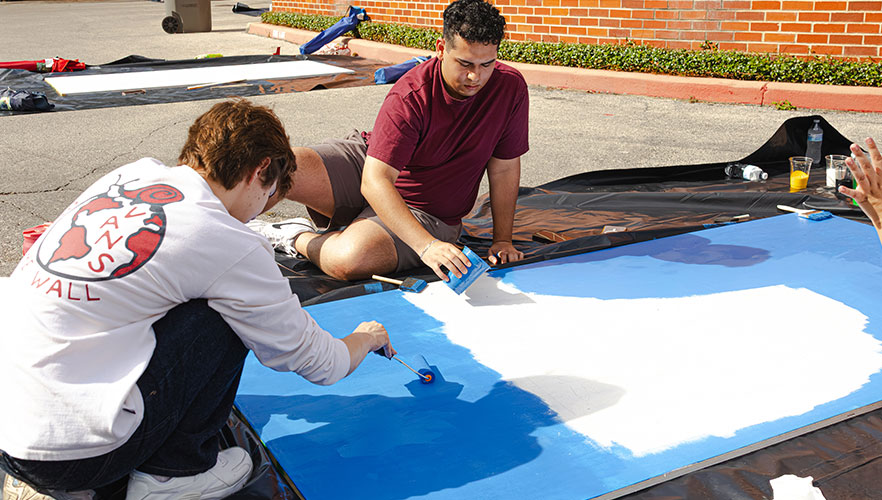 Students painting display board