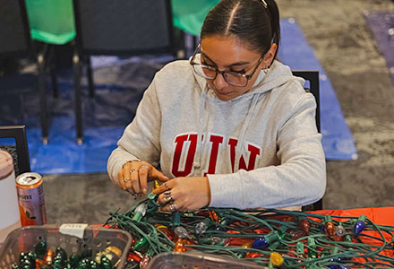 Student volunteer preparing Light the Way lights