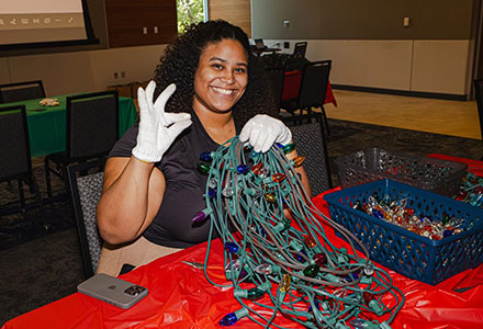 Student volunteer preparing Light the Way lights