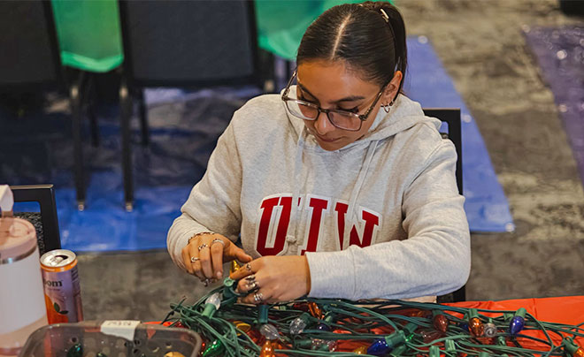 Student volunteer preparing Light the Way lights