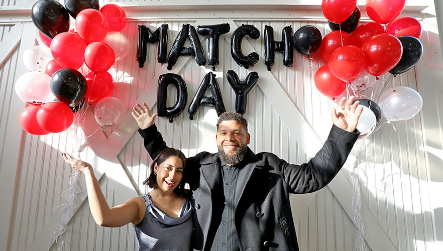 Matched students smiling