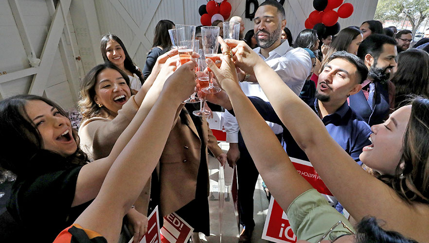 Students toasting to their Match Day results