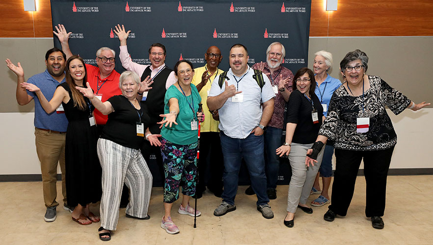 NPM attendees smiling and posing together