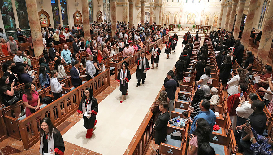 Nursing student walking in the Chapel of the Incarnate Word