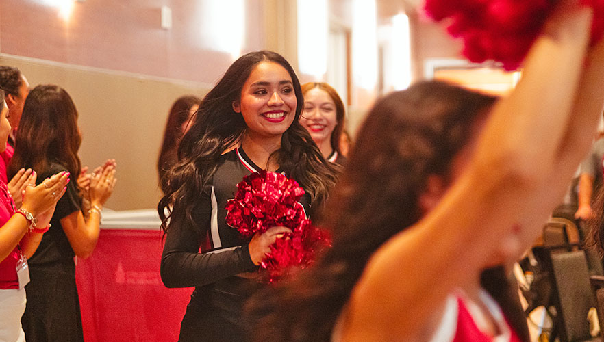 Cheer and Dance team welcoming guests