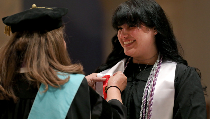 Student receiving pin