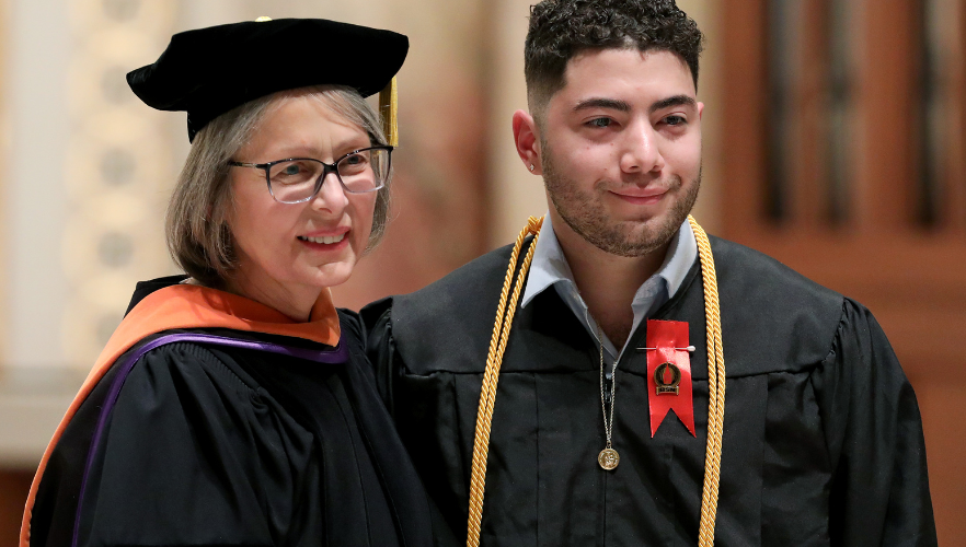 Student receiving pin