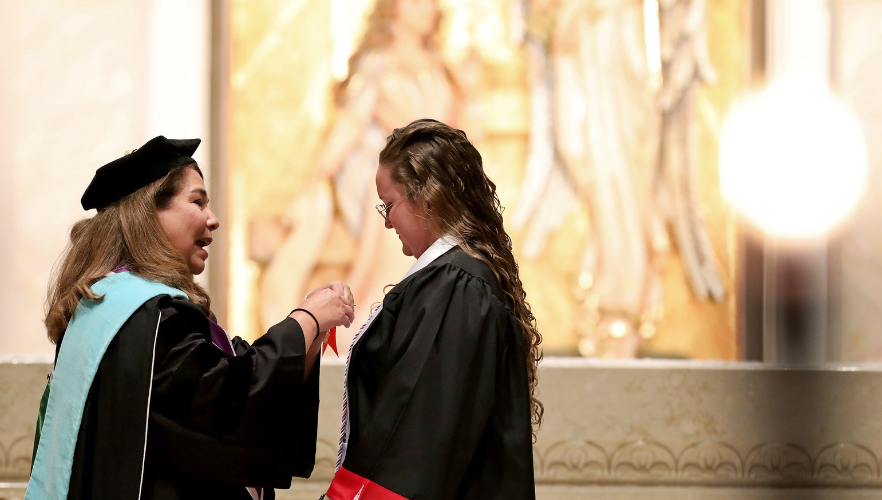 Student receiving pin