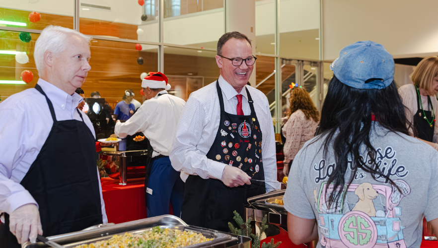Dr. Thomas Evans serving students at Posada