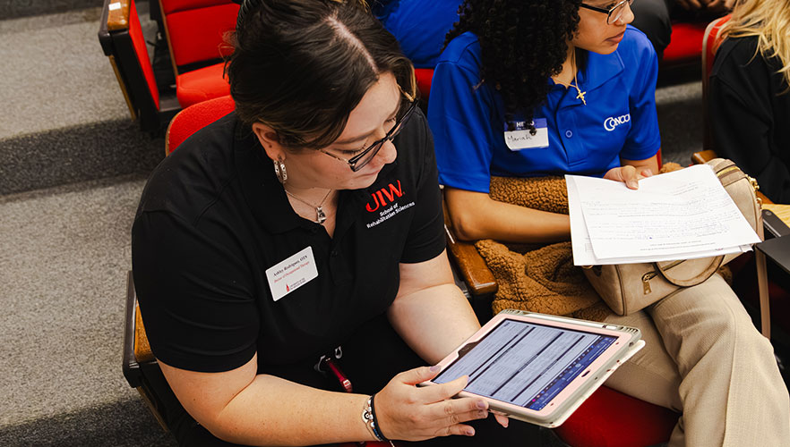 UIW student looking at tablet