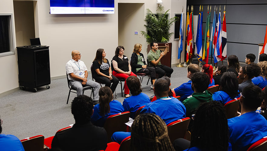 Students listening to panel speakers