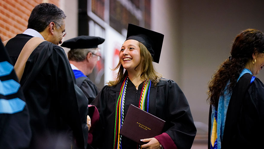St. Anthony Catholic High School graduate receiving diploma 
