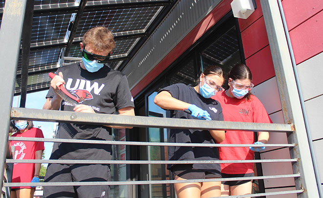 Students repainting Solar House