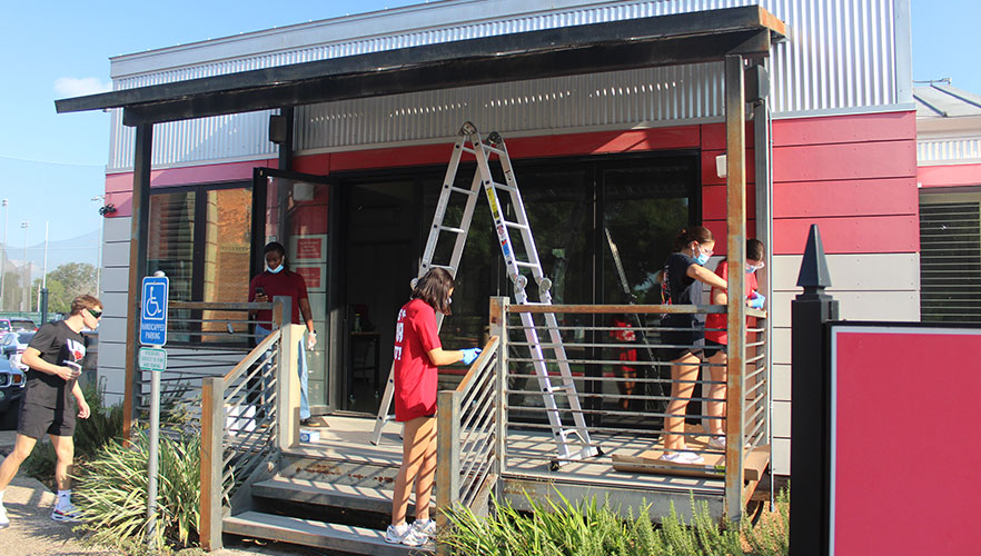 Students repainting Solar House