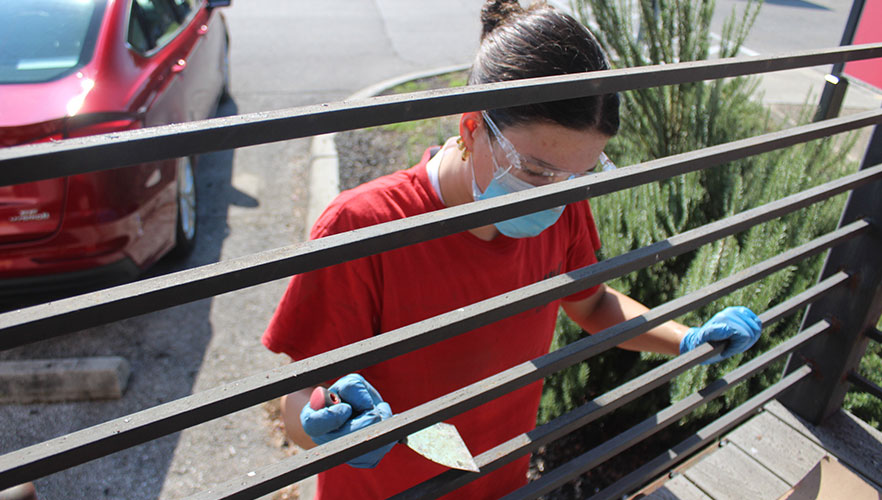 Student repainting Solar House